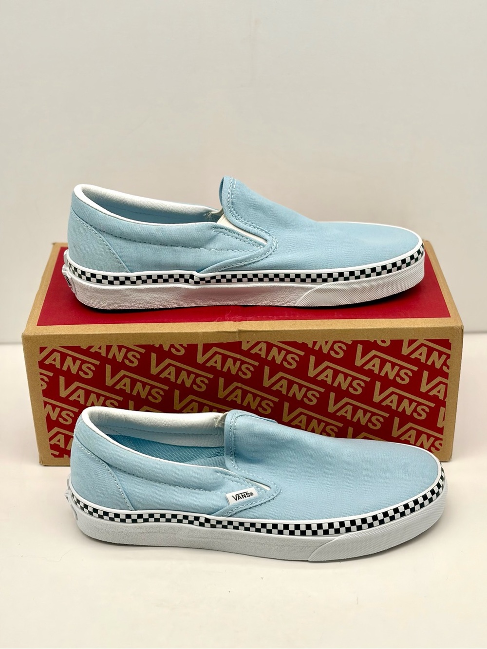 Vans Slip-On Sneakers in Light Blue with Checkerboard Trim